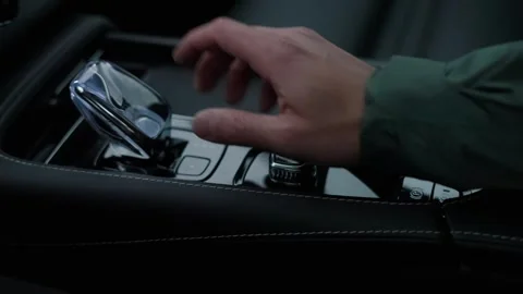 Close-Up of Man’s Hand Starting Engine and Shifting Gears in Automatic SUV Stock Footage 301548923