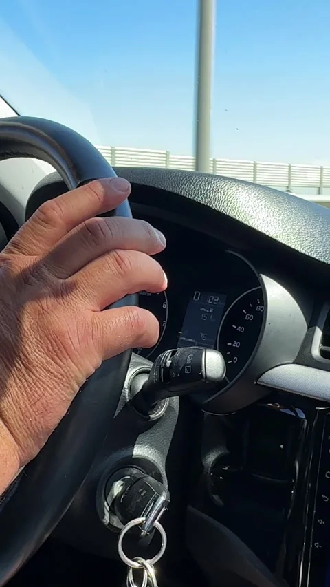 Close up man's hand on steering wheel, driving on highway, automotive, driving Stock Footage 287459573
