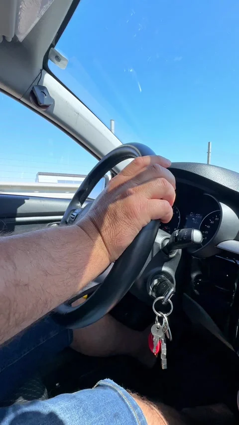 Close up man's hand on steering wheel, driving on highway, automotive, driving Stock Footage 287460823