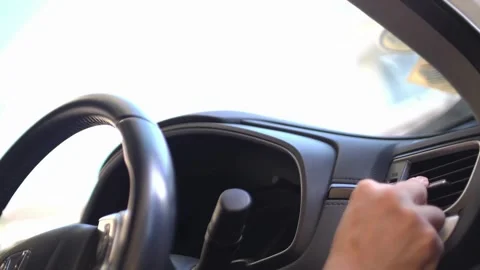 Close up from a man's hand on a steering wheel in a sunny day, driving a car. Stock-Footage 336265989