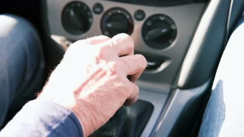 Close-up of a man's hand switches the speed to neutral. Stock Footage 149594318