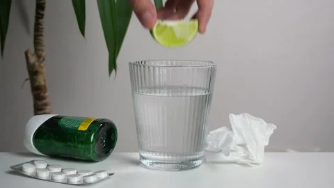 Close-up of a man's hand taking a lime from a table Stock Footage 309474461