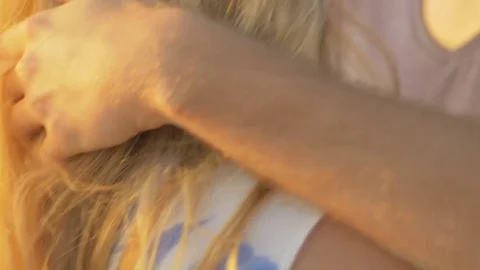 Close-up of man's hand touching girlfriend's hair Stock Footage 73782135