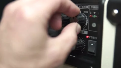 Close up of a man's hand turn off an amplifier. Man hand turning knobs 스톡 동영상 167004445