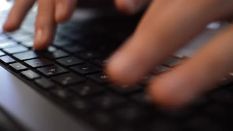 Close-up man's hand typing on his laptop on his office's desk Stock-Footage 202133105