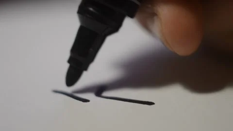 Close-up man's hand use a black marker for design on paper. Stock-Footage 230238771