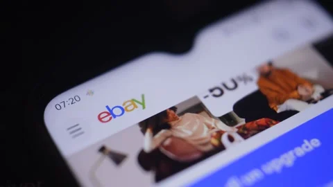 Close-up man's hand using ebay shopping app on the iphone. Stock-Footage 228907239