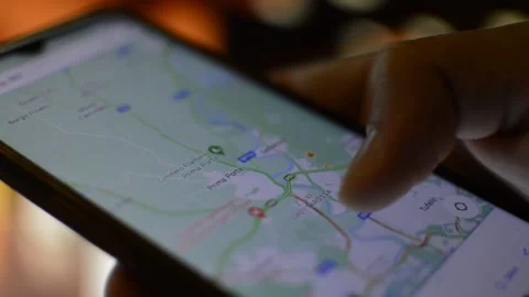Close-up man's hand using google gps maps app. phone gps in closeup Stock Footage 201075417