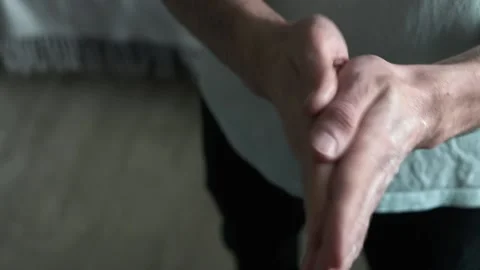 Close-up with man's hand using hand cream to care about skin. Stock Footage 171750142