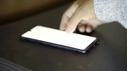 Close up of a man's hand using his cell phone Stock Footage 272254945