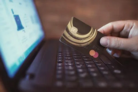 Close-up man's hand using notebook for shopping online. Stock Photos