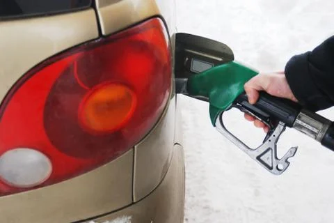 Close-up of a man's hand using a petrol pump Stock Photos