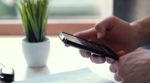 Close up of man's hand using smart phone Stock Footage 63367166