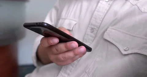 Close-up Man's hand using smart phone. Stock Footage 223975695