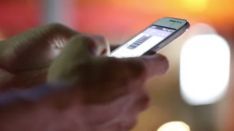 Close-up of a man's hand using smartphone in the city. Video stock 75524864
