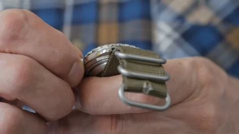 Close-up of a man's hand, which starts the mechanism of the manual clock 스톡 동영상 107723038