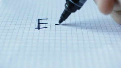 Close-up man's hand write relativity theory by einstein on paper. Stock-Footage 220843374