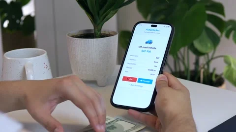 Close-up of a mans hands browsing car listings on a smartphone, then Stock Footage 314827468