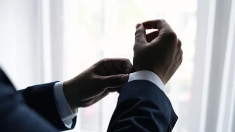 Close-up of a man's hands in a classic jacket and white shirt Stock Footage 263961469