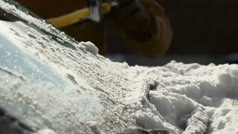 Close-up of a man's hands cleaning snow off wiper blades. Stock Footage 120418970
