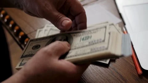 Close-up of man's hands counting dollar money. budget allocation of money. Stock Footage 336259983