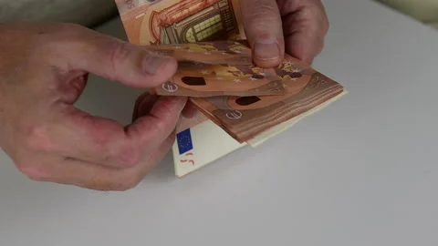 Close-up of man's hands counting stack of euro paper currency, money cash Stock Footage 144931824