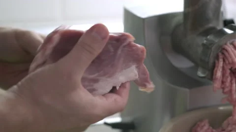 Close up of mans hands cut raw meat with the knife in the kitchen. Preparation Video stock 165055386