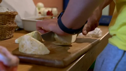 Close-up, Man's hands cutting white beetroot. Slow motion 4K 库存影片 317188262