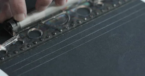 Close up of man’s hands drawing lines on the black paper Stock-Footage 147941687