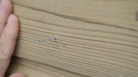 Close-up of man's hands hammering nails Stock Footage 312166883