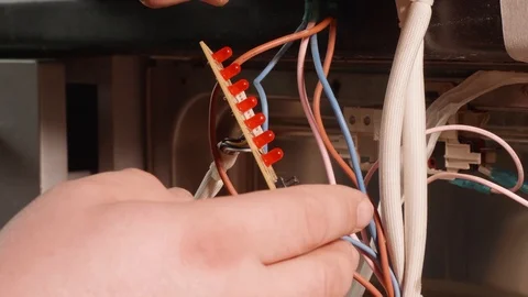 Close up of man's hands handling electronic card in hands and examining it. Stock Footage 107883815