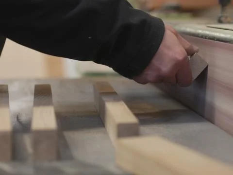 Close-up of man's hands holding small wooden plank Stock Photos