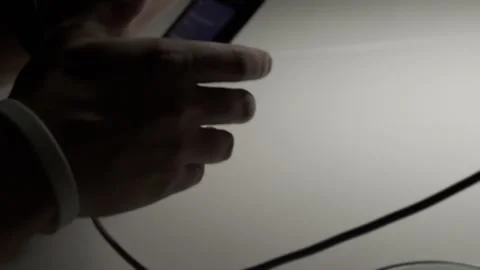 Close-up of man's hands holding a smartphone and scrolling through the news Stock Footage 305245784