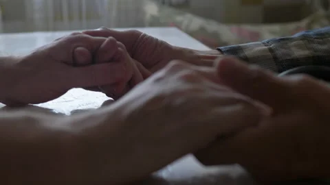 Close-up of a man's hands hugging the hands of an old man, selective focus. adul Stock Footage 226153285