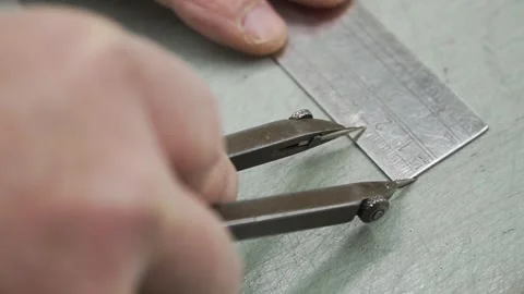 Close-Up of Man's Hands Measuring Distance with Caliper and Ruler Stock Footage 278935452