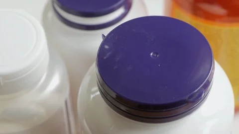 Close-up of a man's hands opening a jar with biologically active additives. Stock Footage 111302830