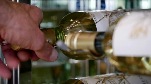 Close up of man's hands opening a wine refrigerator in contemporary home. Stock Footage 98014061