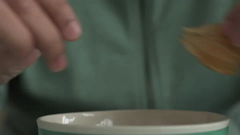 Close up man's hands peeling a cape gooseberry Stock Footage 134577224