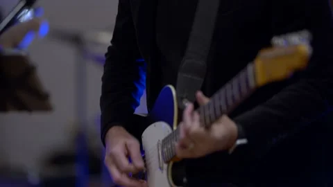 Close-up of a man's hands playing on a electric guitar, 4K Stock Footage 173555492