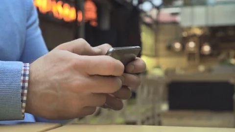 Close up on man's hands playing games on smartphone, indoor, close profile 库存影片 73077397