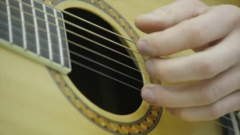 Close-up of a man's hands playing a guitar Stock Footage 85102963