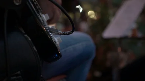 Close-up of a man's hands playing a guitar Stock Footage 96766950