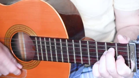 Close-up of a man's hands playing the guitar Stock Footage 130880728