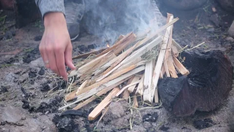 Close up on Man's hands preparing bonfire. Stock Footage 117408056