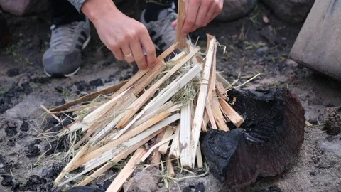 Close up on Man's hands preparing bonfire. Stock Footage 117408616