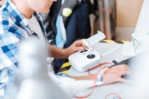 Close up of mans hands programmimg drone remote controller Stock Photos