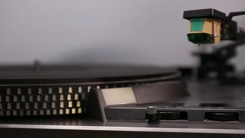 Close up on Man's hands putting a record on a turntable. Stock Footage 121230498