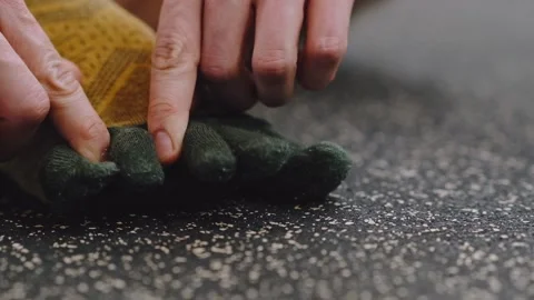 Close-up man's hands putting on socks on his feet.man wears socks on the carpet. Stock Footage 235821182