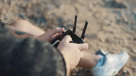 Close up man's hands with remote controller drone. Stock Footage 113632391
