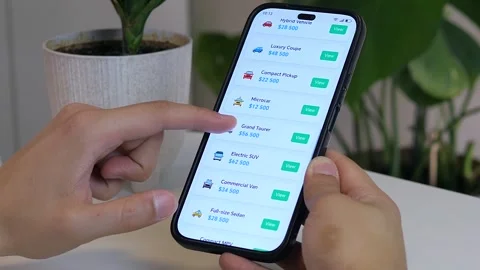 Close-up of a mans hands scrolling through car sale ads on a smartphone Stock Footage 314770574